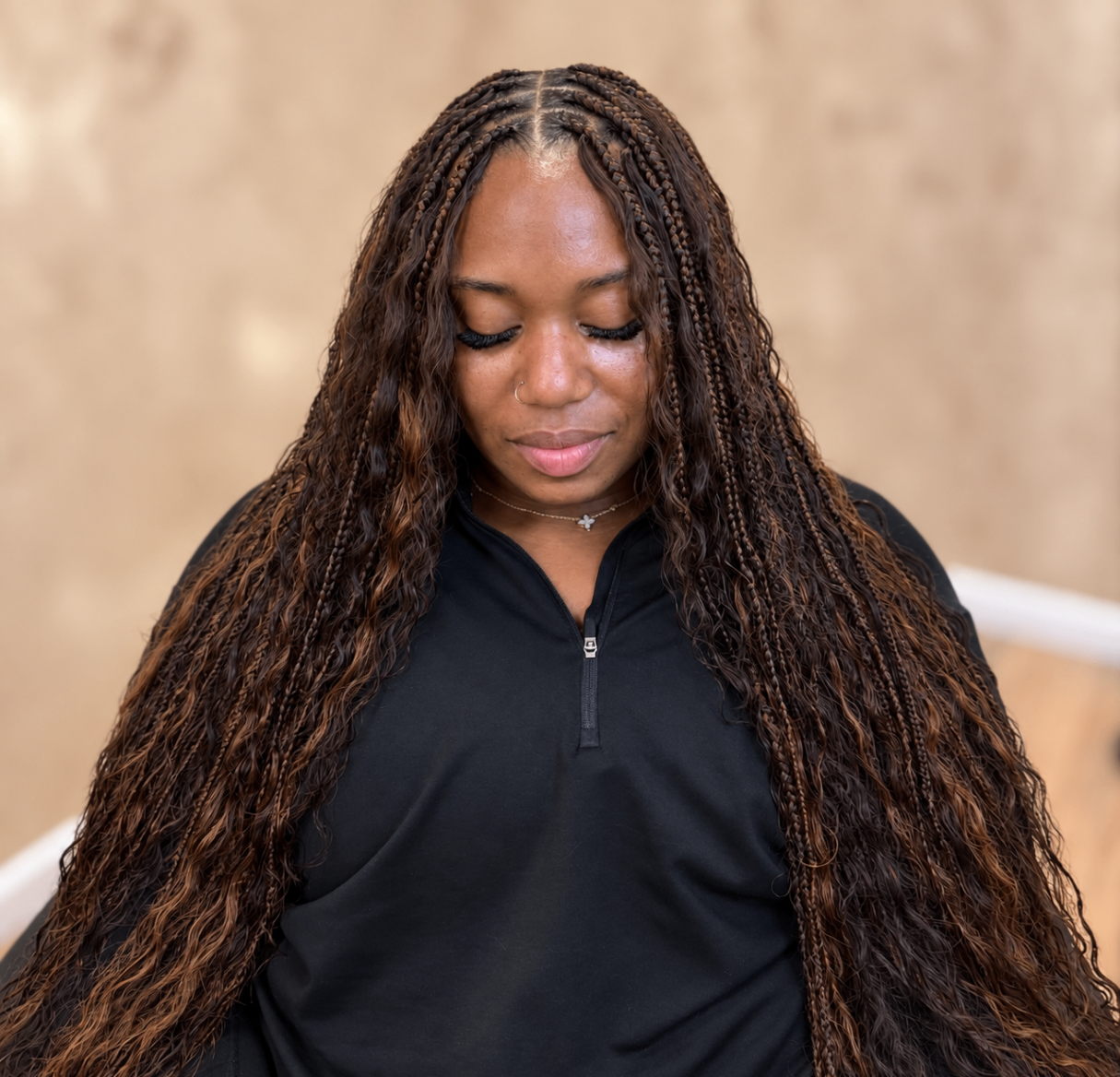 Long highlighted boho braids created at Envy Hair Designs